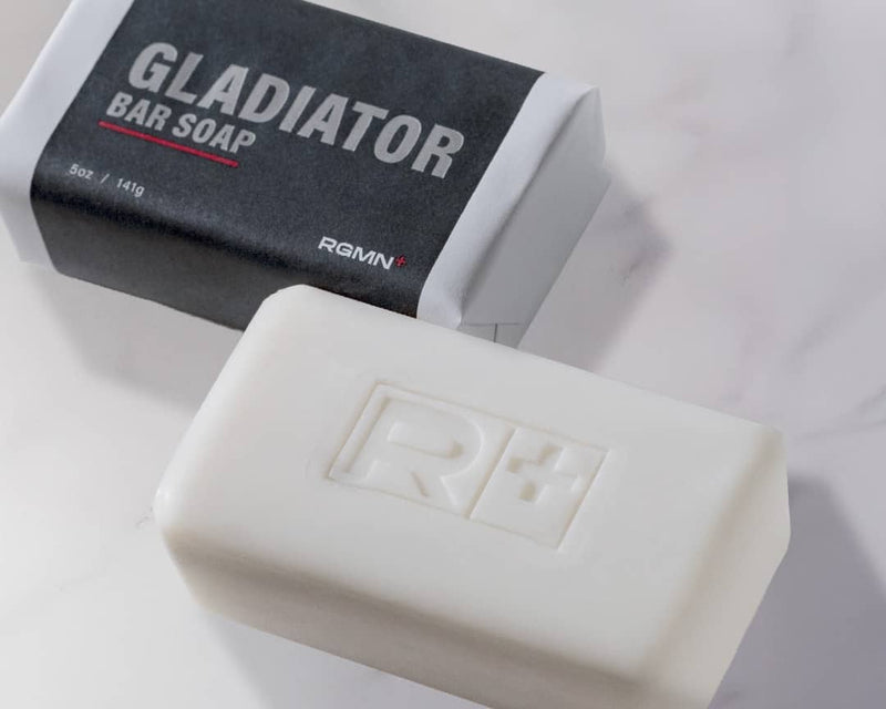 RGMN+ Gladiator bar of soap and packaging on a white background.
