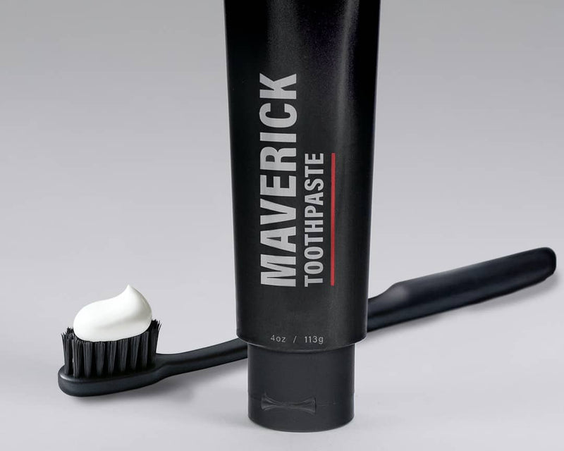 Maverick toothpaste with a toothbrush and toothpaste on a gray background