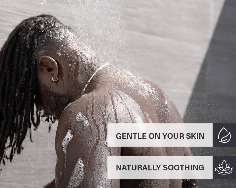 Person under a shower with product callouts about how gentle the product is on your skin and it's naturally soothing benefits
